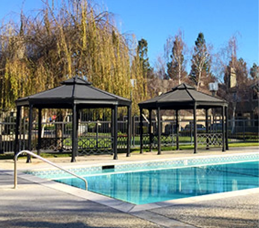 Two gazebos by a swimming pool